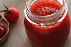 Tomate triturado en bote para envasado industrial con maquinaria CDE